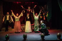 (front right) Kevin Webb with (back, l to r) Matt McNabb, Maiko Terazawa, Megan DeLay, Ryan Lanning, Jessica Lauren Fisher and Jeremy Trager in Black Button Eyes Productions’ Chicago premiere musical NEVERMORE – The Imaginary Life and Mysterious Death of Edgar Allan Poe