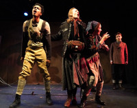 Rashaad A. Bond, Holly Cerney, Joan Nahid, and Caleb Lee Jenkins in “Mother Courage and her Children,” playing at Trap Door Theatre through February 24, 2024.